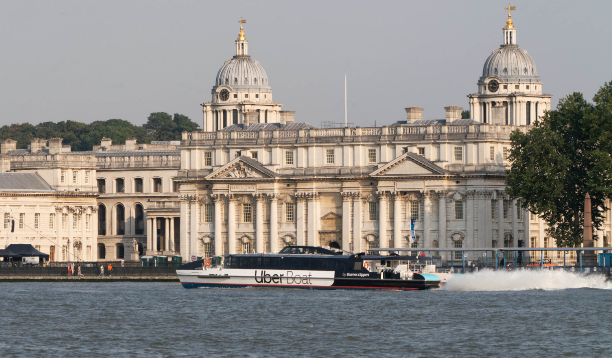 Uber Boat by Thames Clippers sailing past the Old Royal Naval College in Greenwich